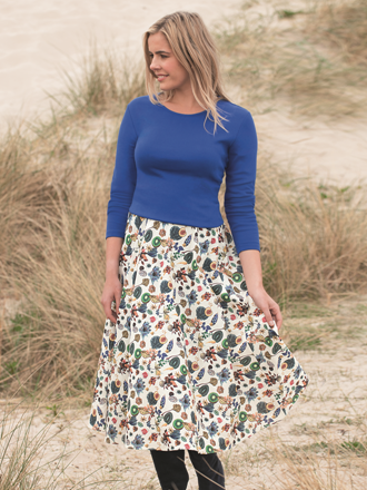 Sebago Liberty print House of Bruar exclusive blond model on beach in skirt